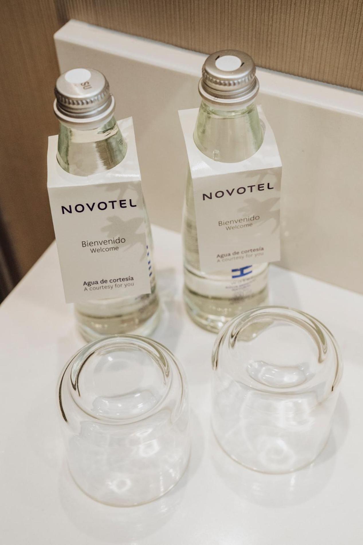 Novotel Medellin El Tesoro Exterior foto Bottled water in a hotel room